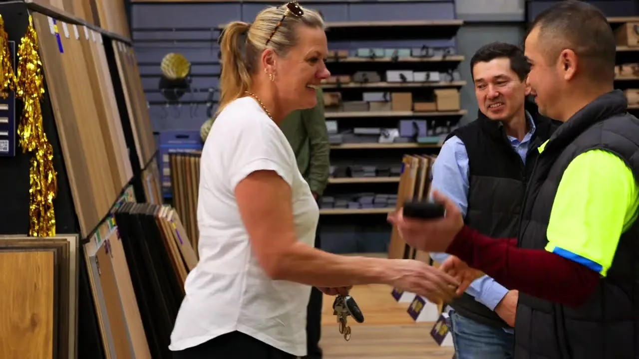 A customer shaking hands with a staff member at the Warragul grand opening